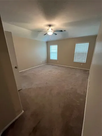 en empty room with windows