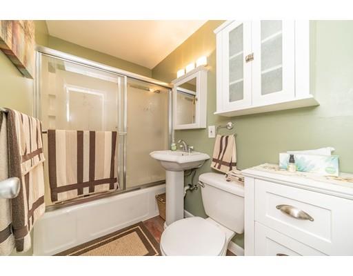 17 Eldridge Street Chicopee, MA 01013 - Photo 13 of 30 a bathroom with a sink toilet a mirror and vanity