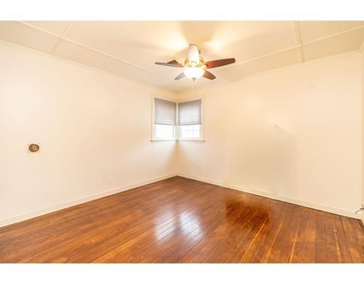 17 Eldridge Street Chicopee, MA 01013 - Photo 14 of 30 en empty room with wooden floor and fan