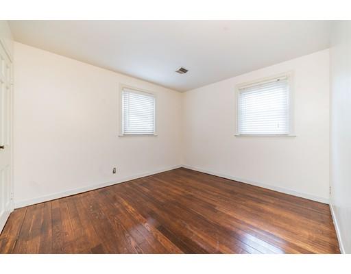17 Eldridge Street Chicopee, MA 01013 - Photo 17 of 30 an empty room with wooden floor and windows
