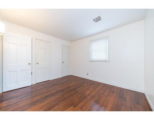 17 Eldridge Street Chicopee, MA 01013 - Photo 18 of 30 a view of an empty room with wooden floor and a window