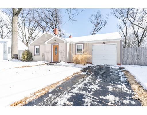 17 Eldridge Street Chicopee, MA 01013 - Photo 28 of 30 a front view of a house with a yard covered in snow