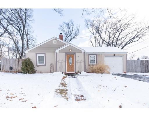 17 Eldridge Street Chicopee, MA 01013 - Photo 29 of 30 a front view of a house with a yard covered in snow