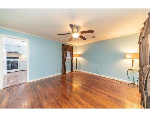 17 Eldridge Street Chicopee, MA 01013 - Photo 3 of 30 a view of empty room with wooden floor and fan