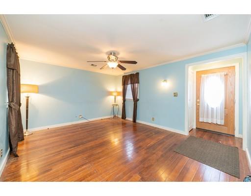 17 Eldridge Street Chicopee, MA 01013 - Photo 4 of 30 a view of an empty room and wooden floor