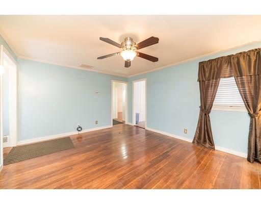 17 Eldridge Street Chicopee, MA 01013 - Photo 6 of 30 a view of an empty room with wooden floor and a window