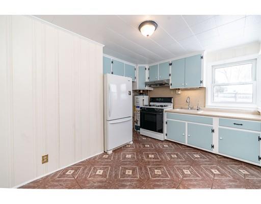 17 Eldridge Street Chicopee, MA 01013 - Photo 8 of 30 a kitchen with a refrigerator sink and cabinets