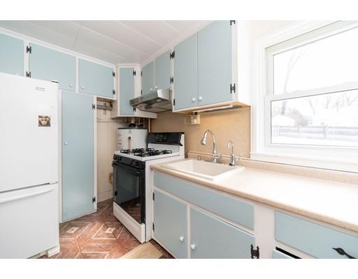 17 Eldridge Street Chicopee, MA 01013 - Photo 10 of 30 a kitchen with a sink a refrigerator and a window