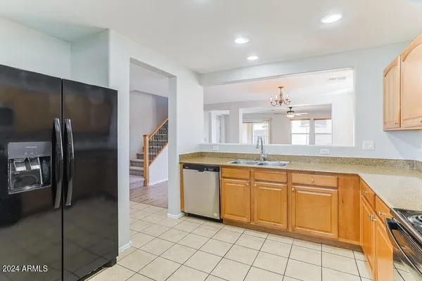 a large bathroom with a large mirror vanity and a shower