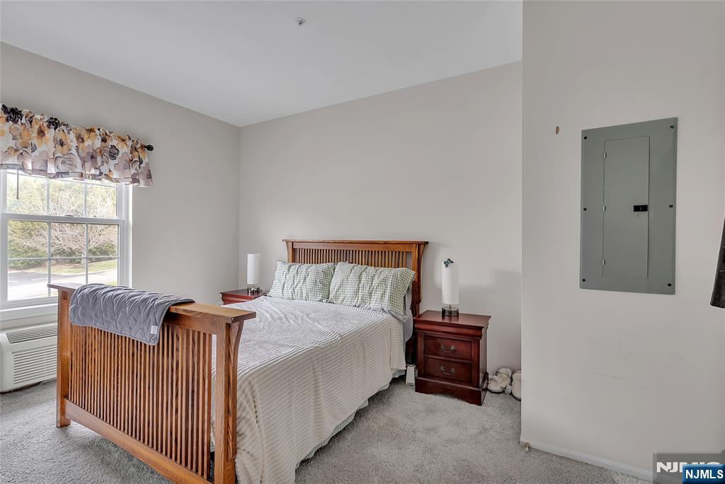 5320 Richmond Road West Milford, NJ 07480 - Photo 13 of 20 a bed sitting in a bedroom next to a window