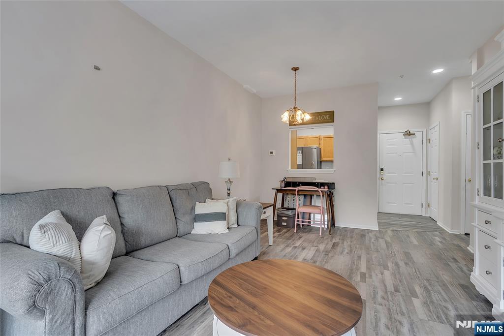 5320 Richmond Road West Milford, NJ 07480 - Photo 6 of 20 a living room with furniture a dining table and a chandelier