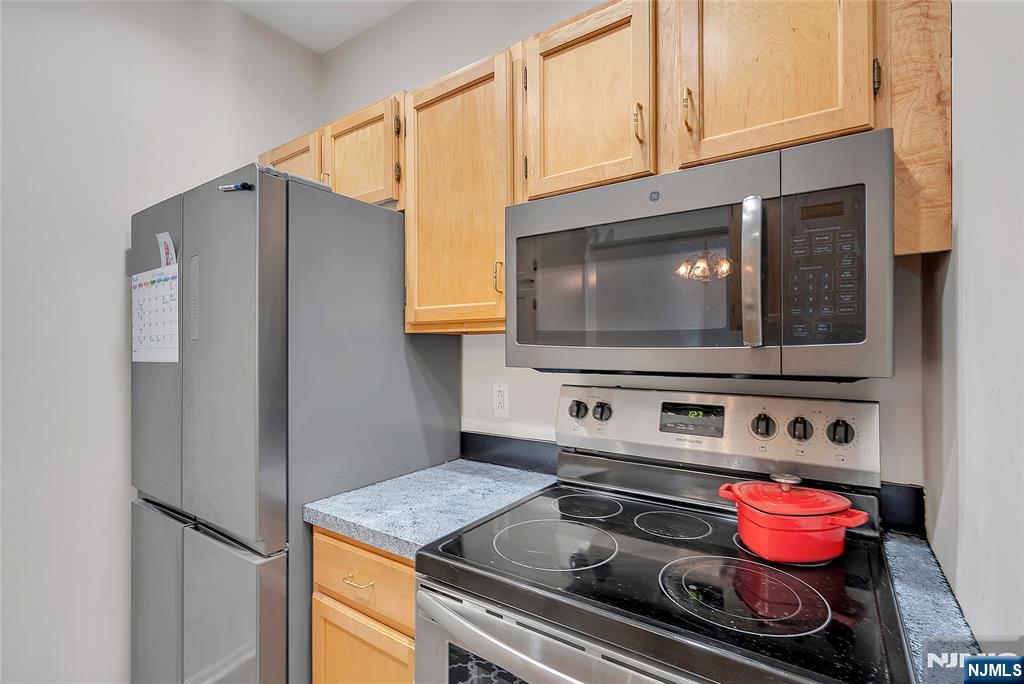 5320 Richmond Road West Milford, NJ 07480 - Photo 9 of 20 a kitchen with a stove and a microwave