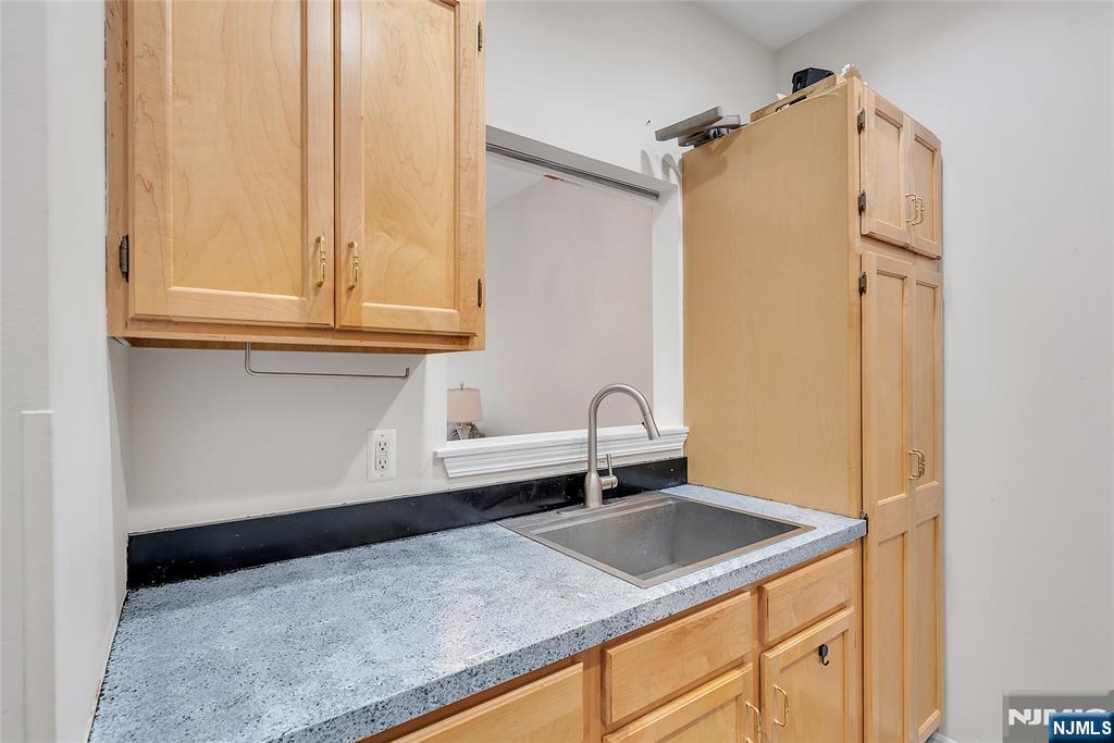 5320 Richmond Road West Milford, NJ 07480 - Photo 10 of 20 a kitchen with stainless steel appliances granite countertop a sink and a white cabinets