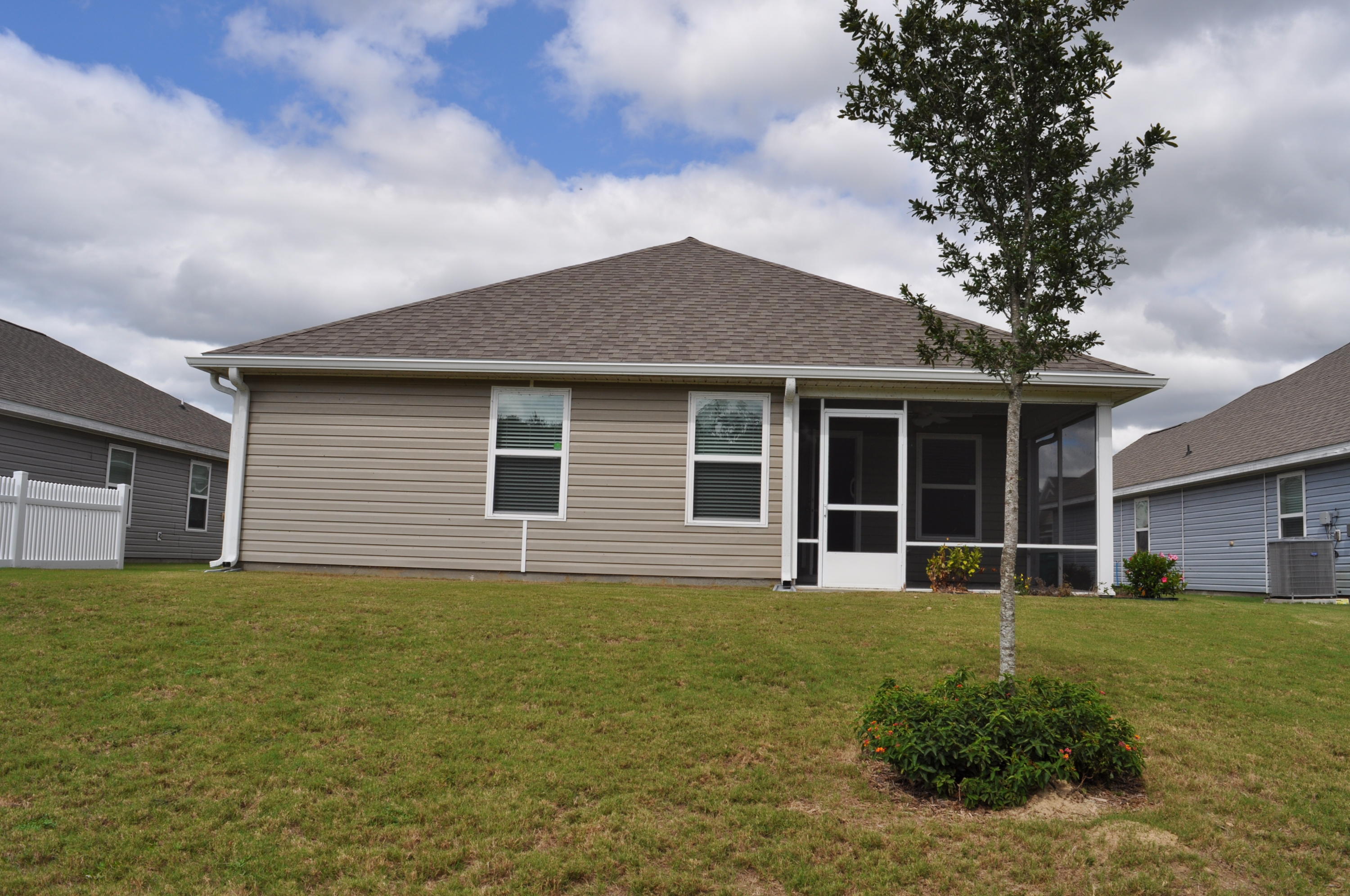 563 Fanny Ann Way Freeport, FL 32439 - Photo 15 of 18 a house view with a garden space