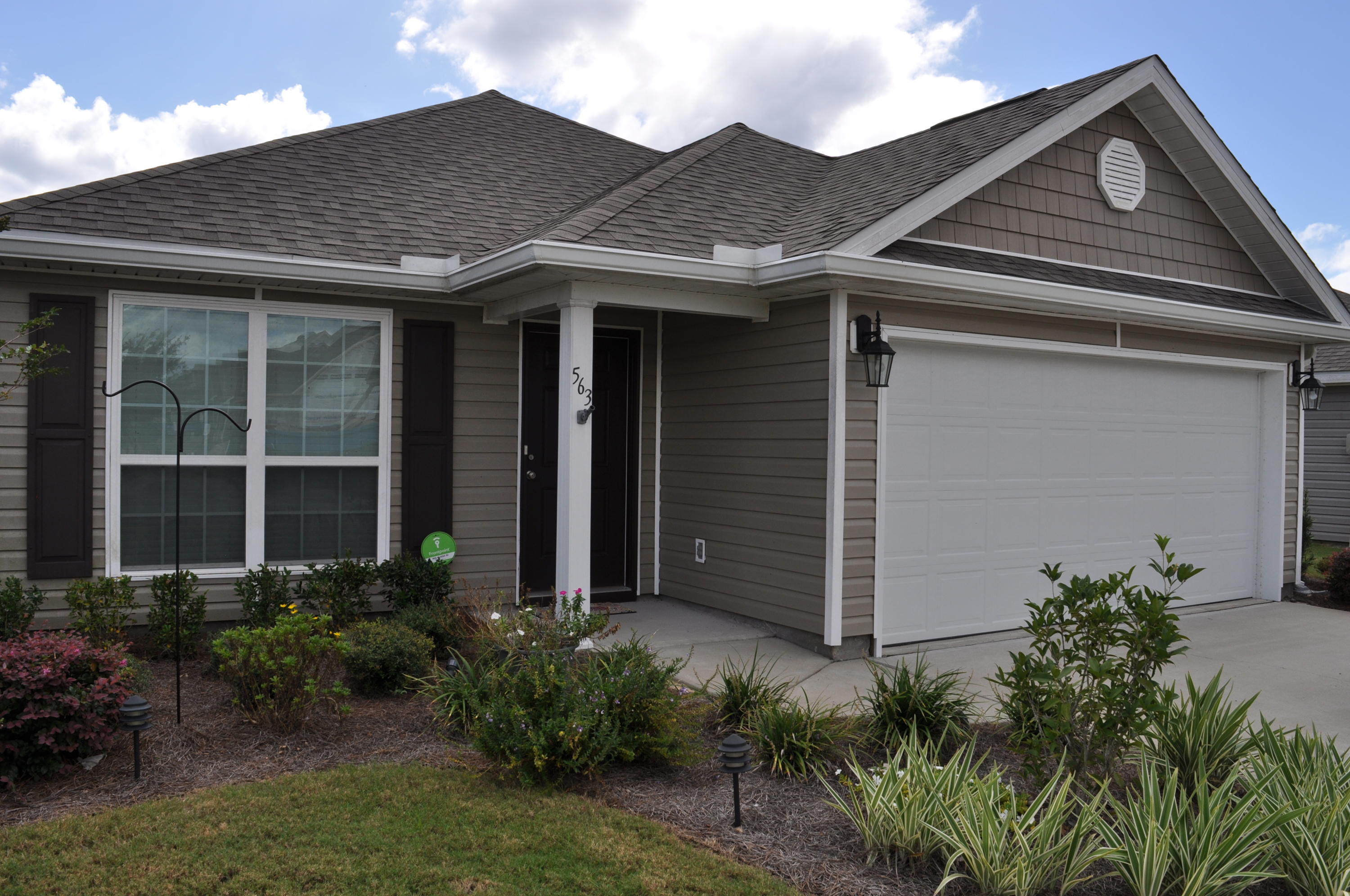 563 Fanny Ann Way Freeport, FL 32439 - Photo 18 of 18 a front view of a house with garden