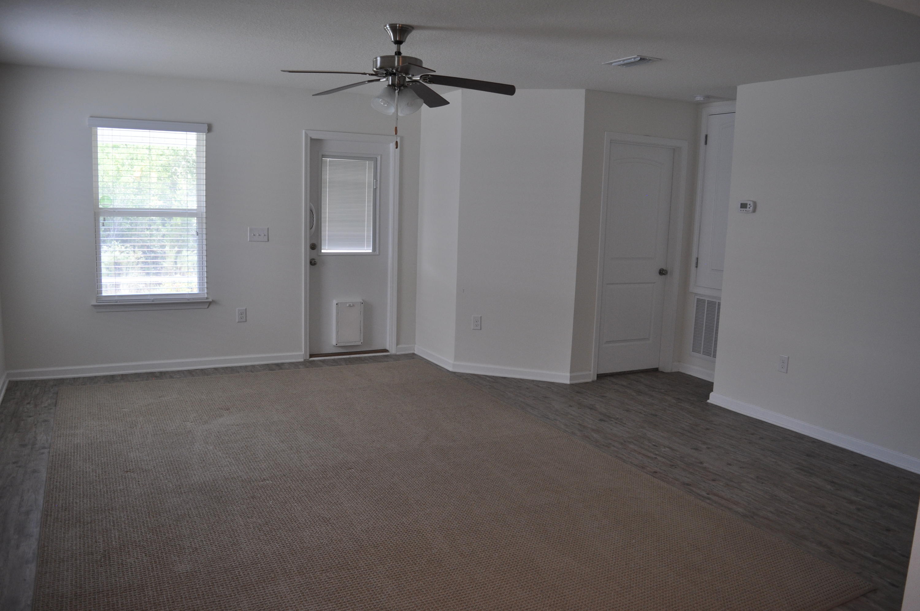 563 Fanny Ann Way Freeport, FL 32439 - Photo 8 of 18 a view of a livingroom with a ceiling fan and window