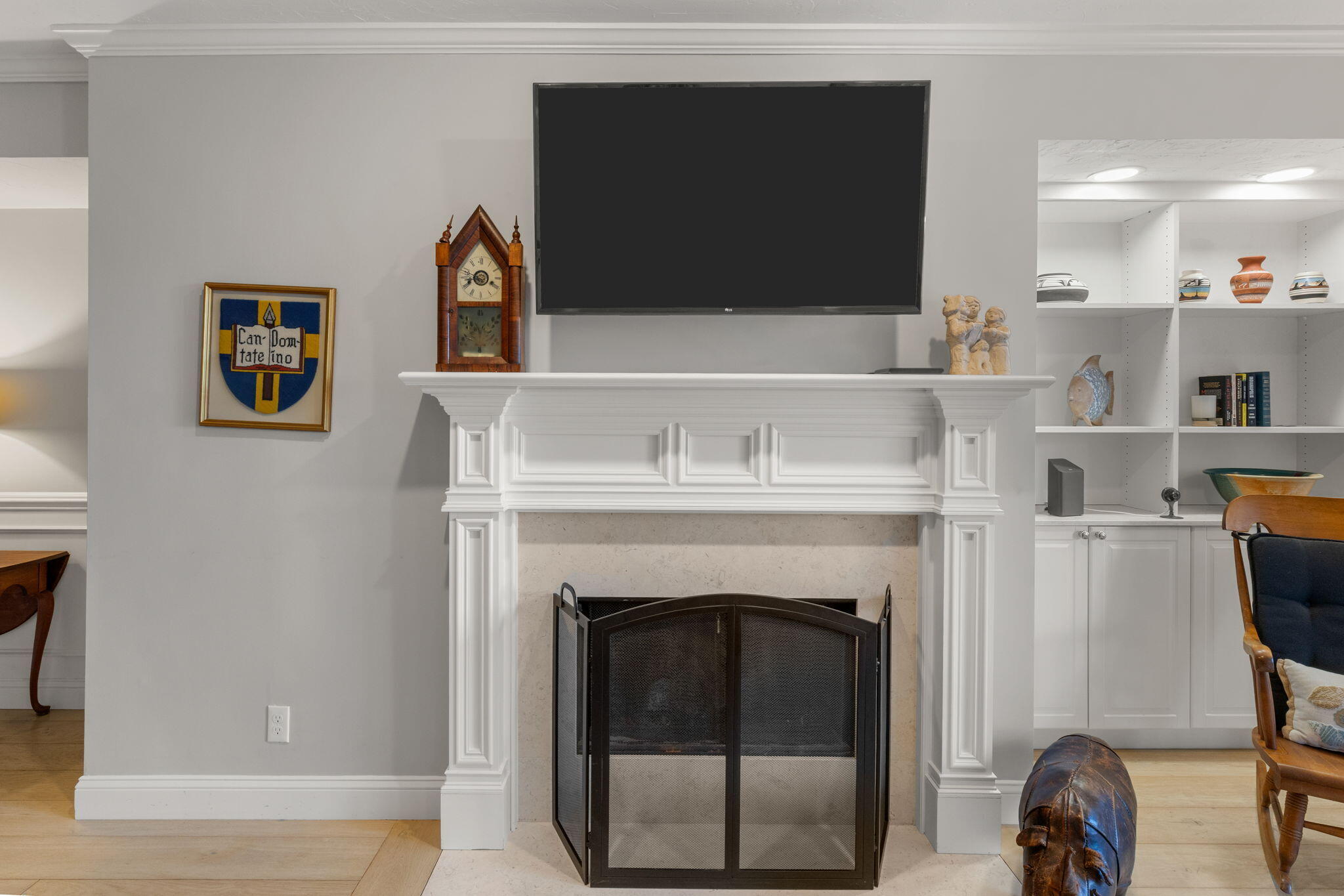 925 Main Street, Unit 3 Cotuit, MA 02635 - Photo 13 of 55 a living room with a fireplace and a flat screen tv