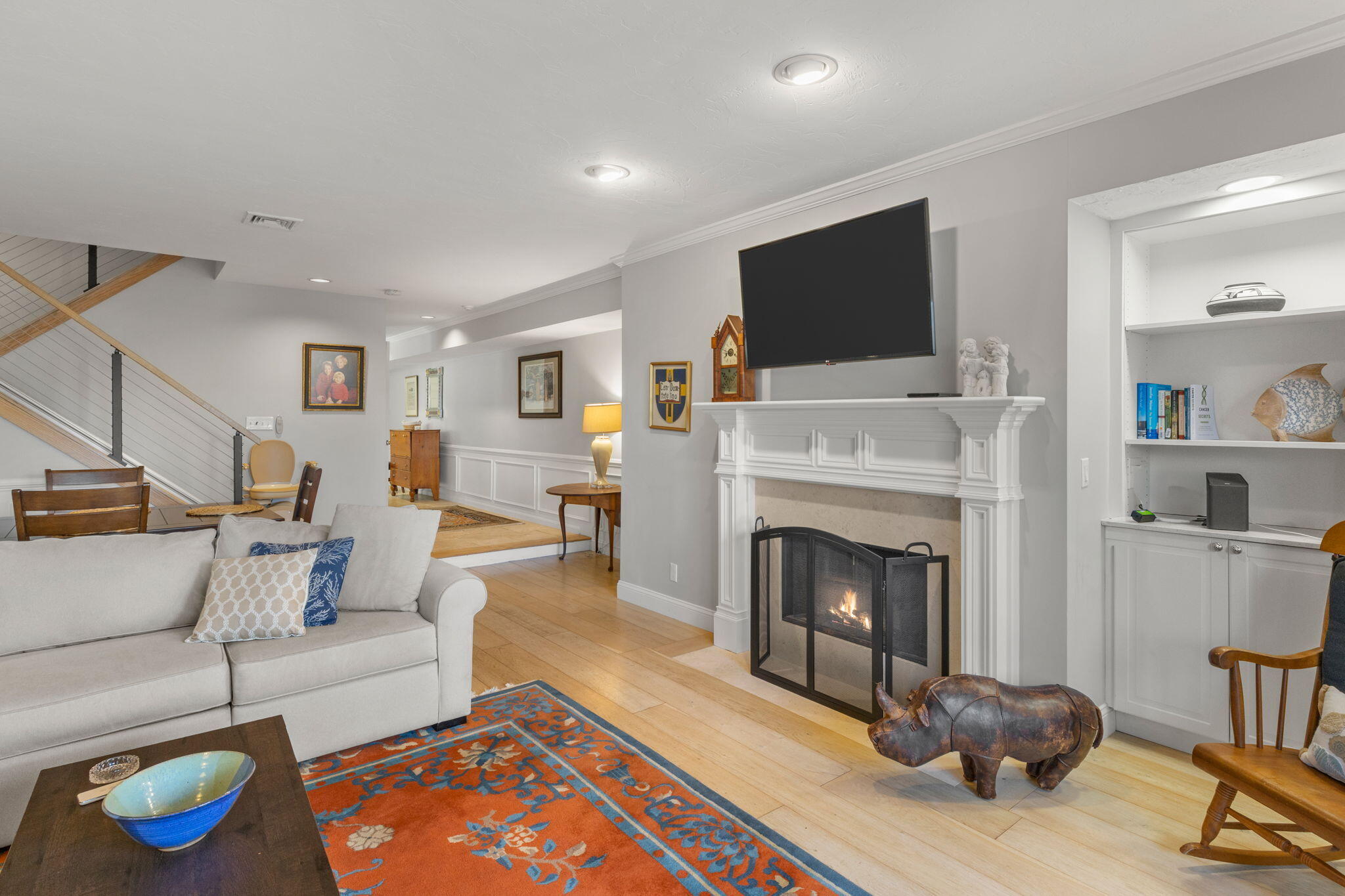 925 Main Street, Unit 3 Cotuit, MA 02635 - Photo 14 of 55 a living room with furniture a flat screen tv and a fireplace