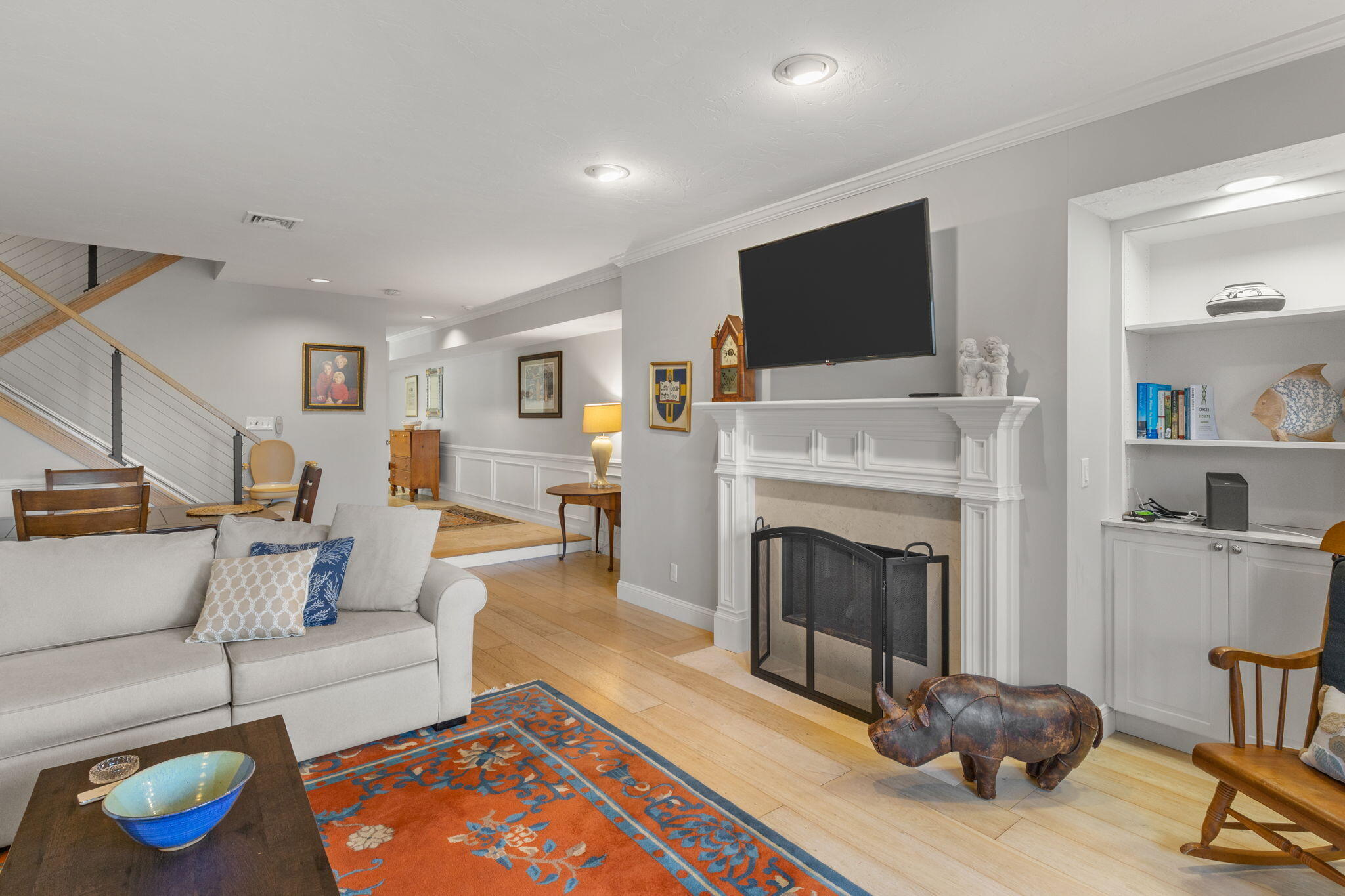 925 Main Street, Unit 3 Cotuit, MA 02635 - Photo 15 of 55 a living room with furniture a flat screen tv and a fireplace
