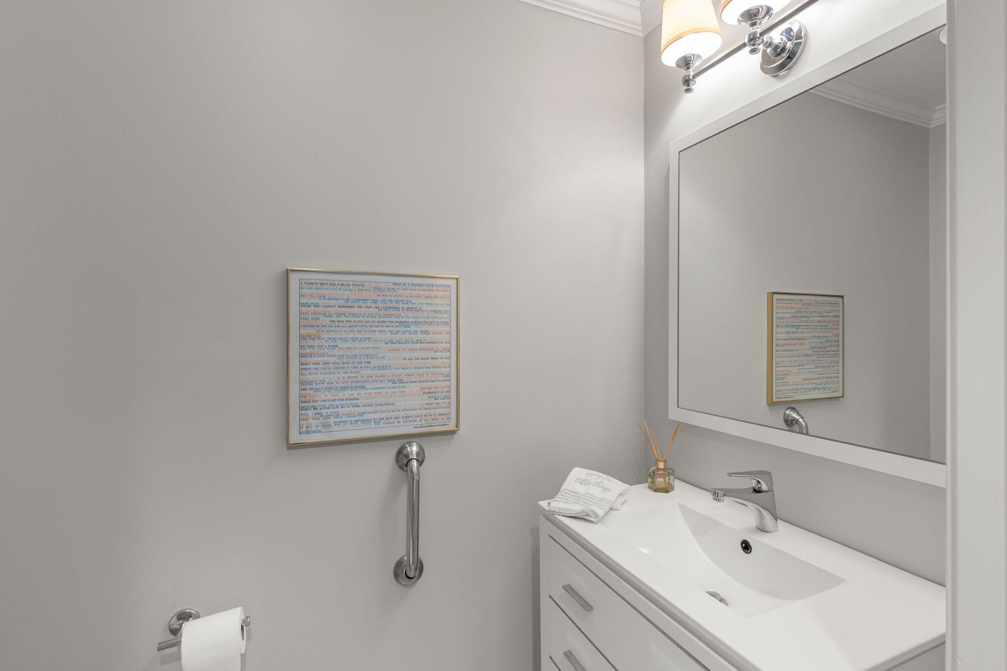 925 Main Street, Unit 3 Cotuit, MA 02635 - Photo 17 of 55 a bathroom with a sink a vanity and a mirror