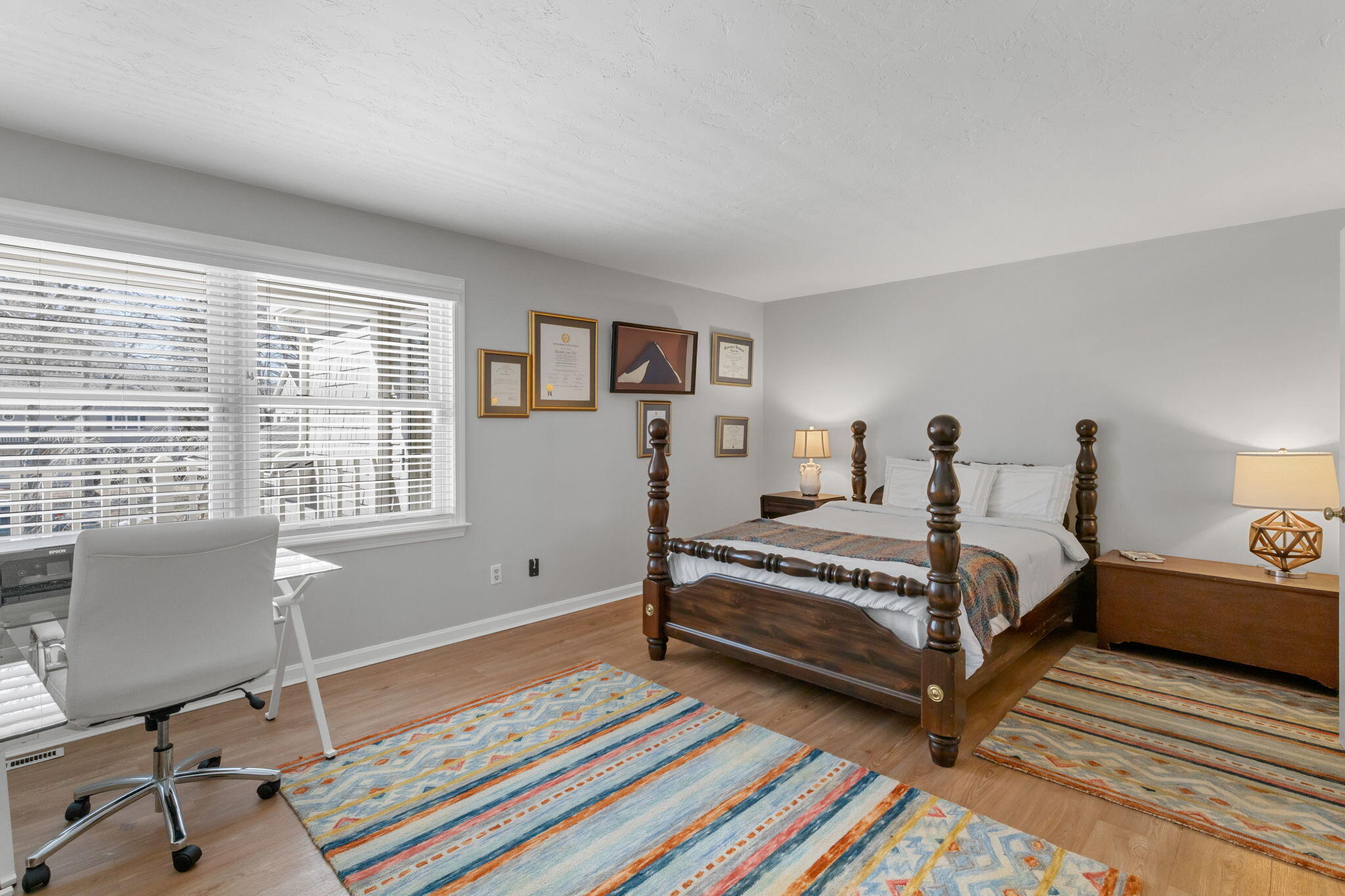925 Main Street, Unit 3 Cotuit, MA 02635 - Photo 18 of 55 a spacious bedroom with two beds and a desk