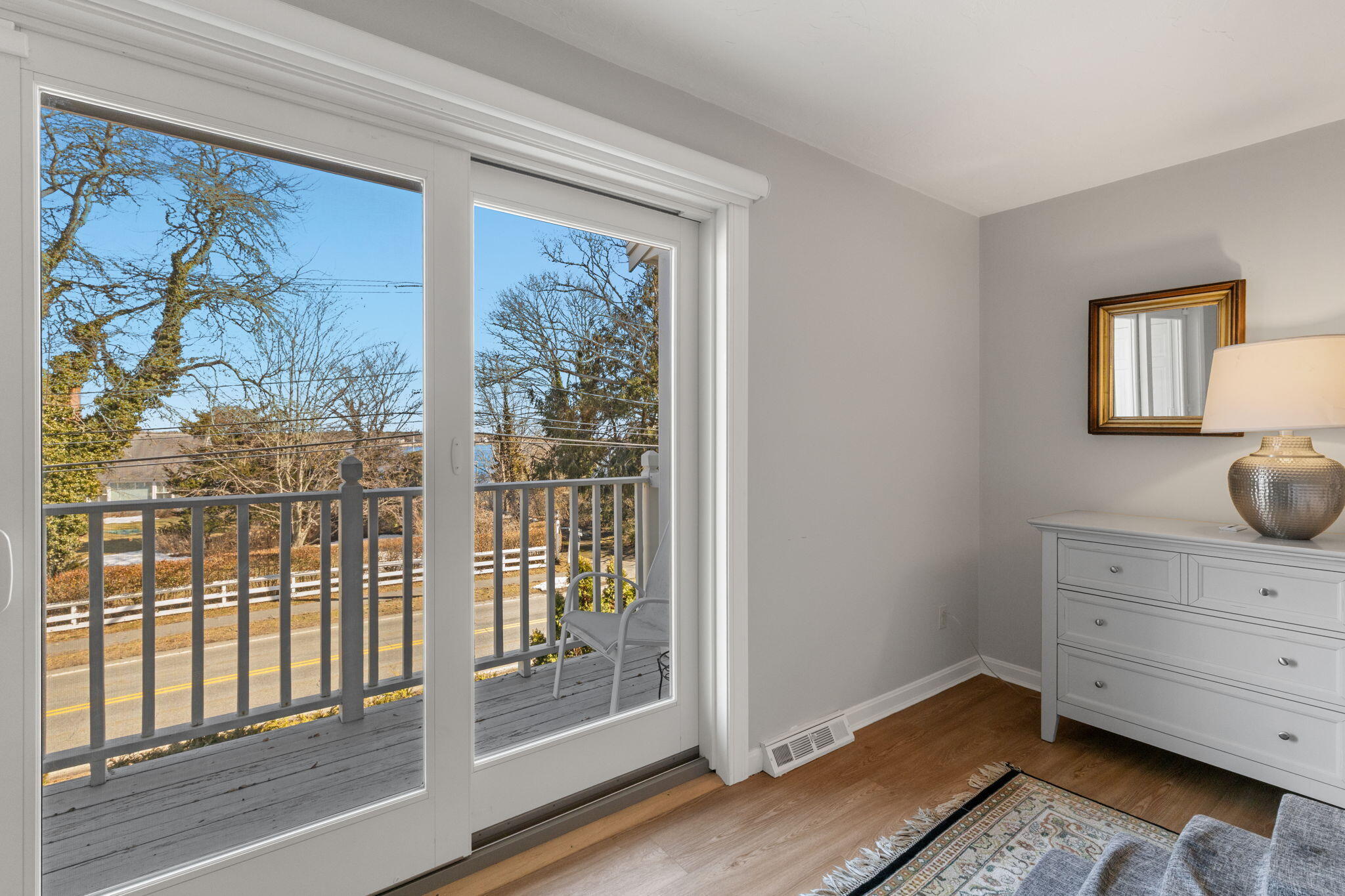 925 Main Street, Unit 3 Cotuit, MA 02635 - Photo 22 of 55 a view of room with window and wooden floor