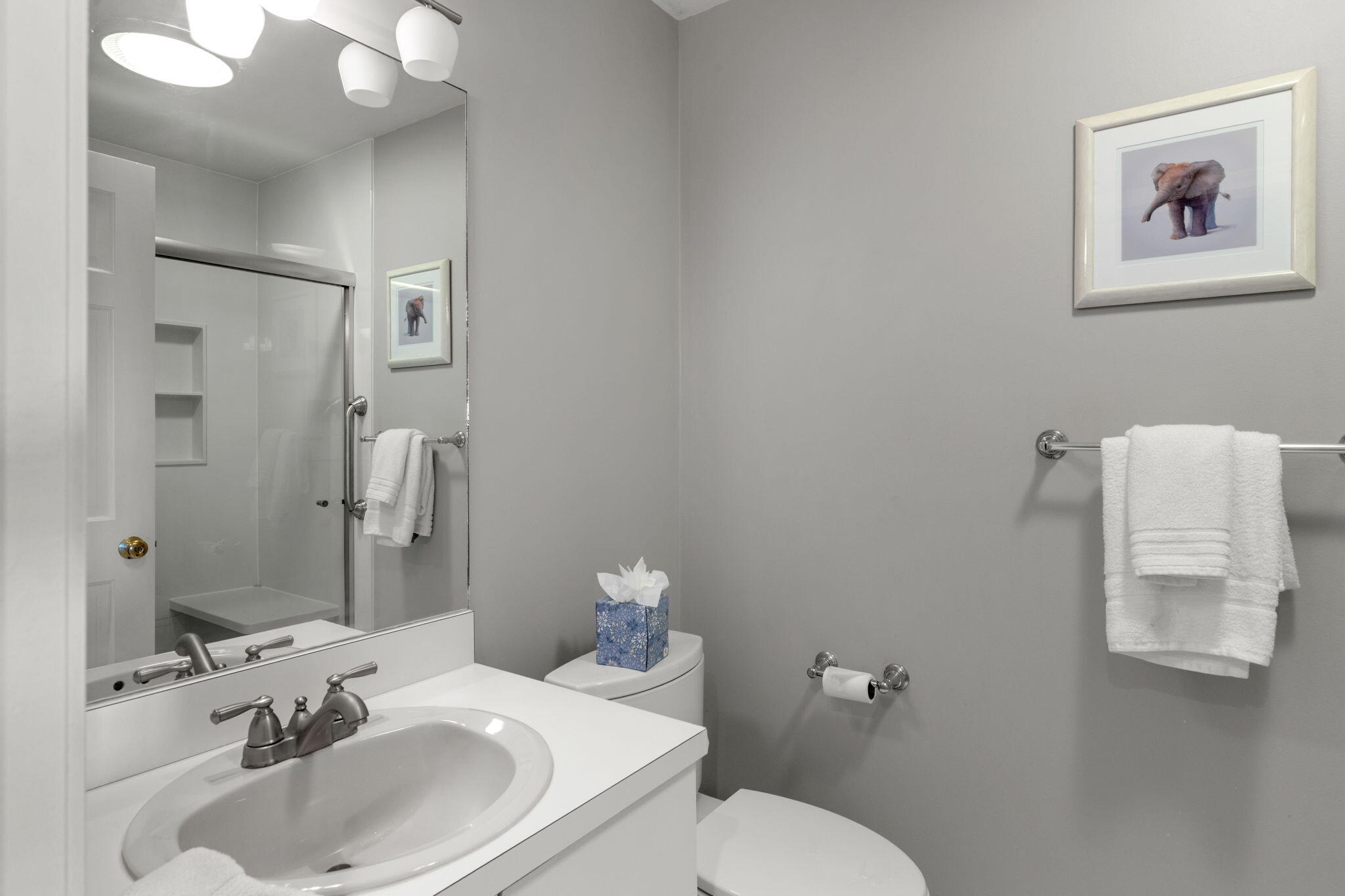 925 Main Street, Unit 3 Cotuit, MA 02635 - Photo 23 of 55 a bathroom with a sink mirror and toilet