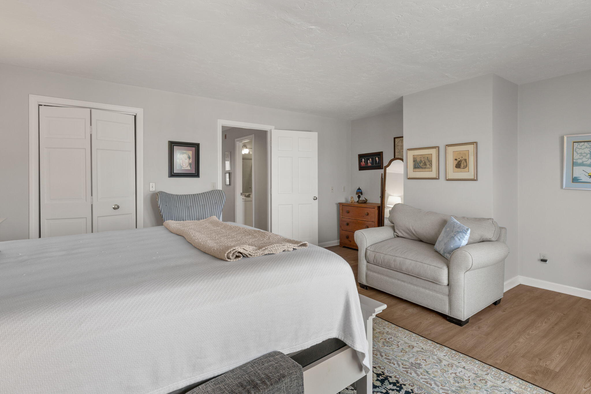 925 Main Street, Unit 3 Cotuit, MA 02635 - Photo 25 of 55 a bedroom with a bed couch and a window