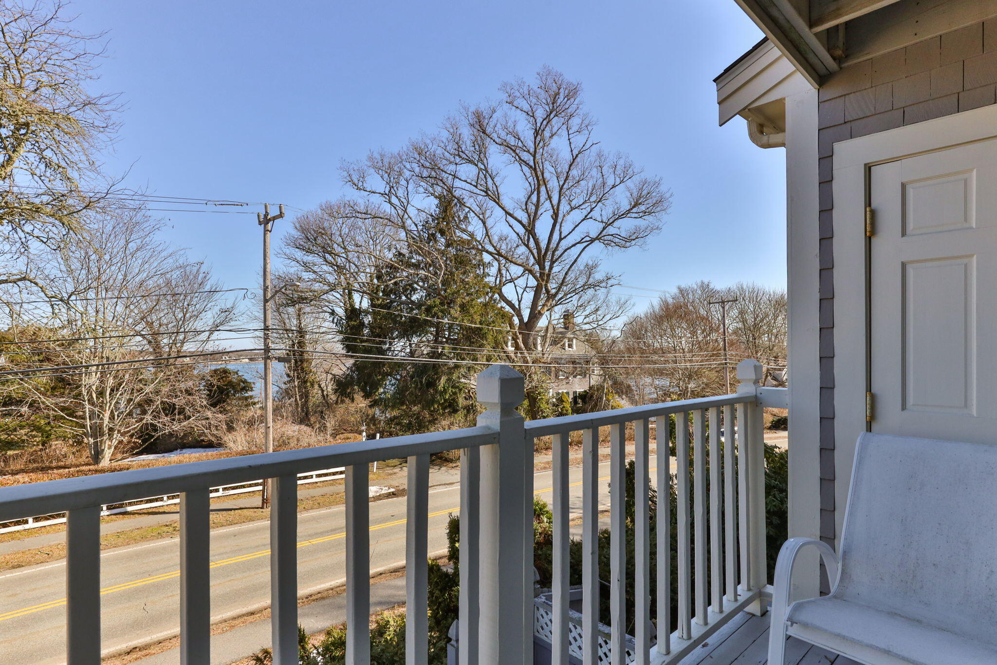925 Main Street, Unit 3 Cotuit, MA 02635 - Photo 26 of 55 a view of a balcony with wooden fence and floor