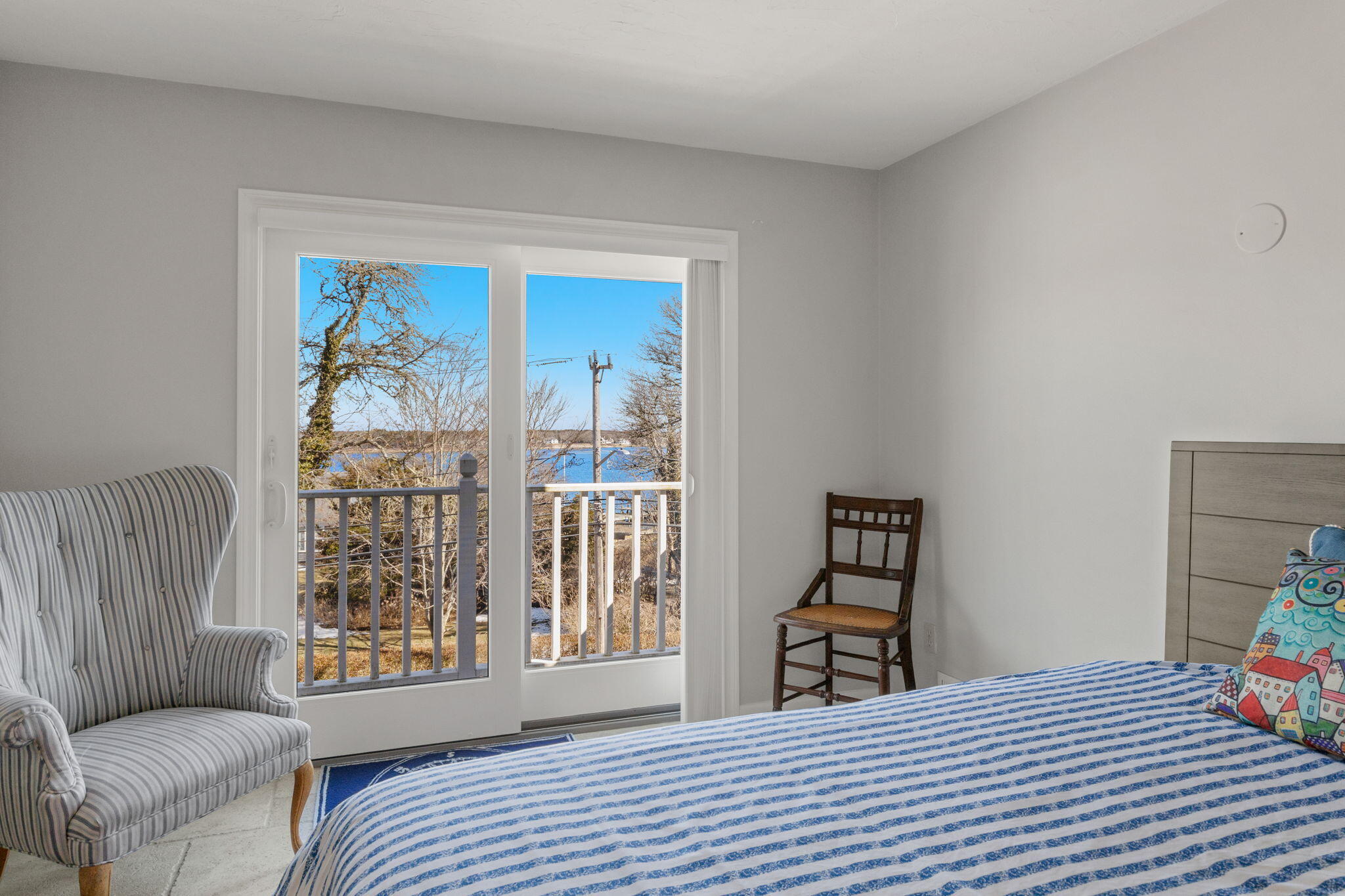 925 Main Street, Unit 3 Cotuit, MA 02635 - Photo 31 of 55 a bedroom with a bed and a couch