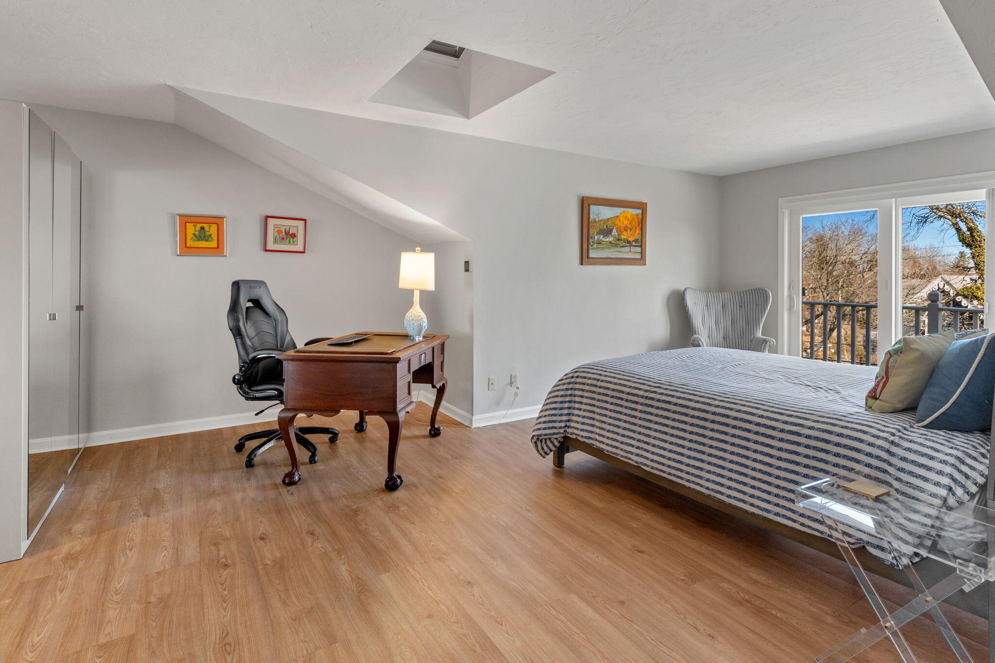 925 Main Street, Unit 3 Cotuit, MA 02635 - Photo 32 of 55 a bedroom with a bed and a desk