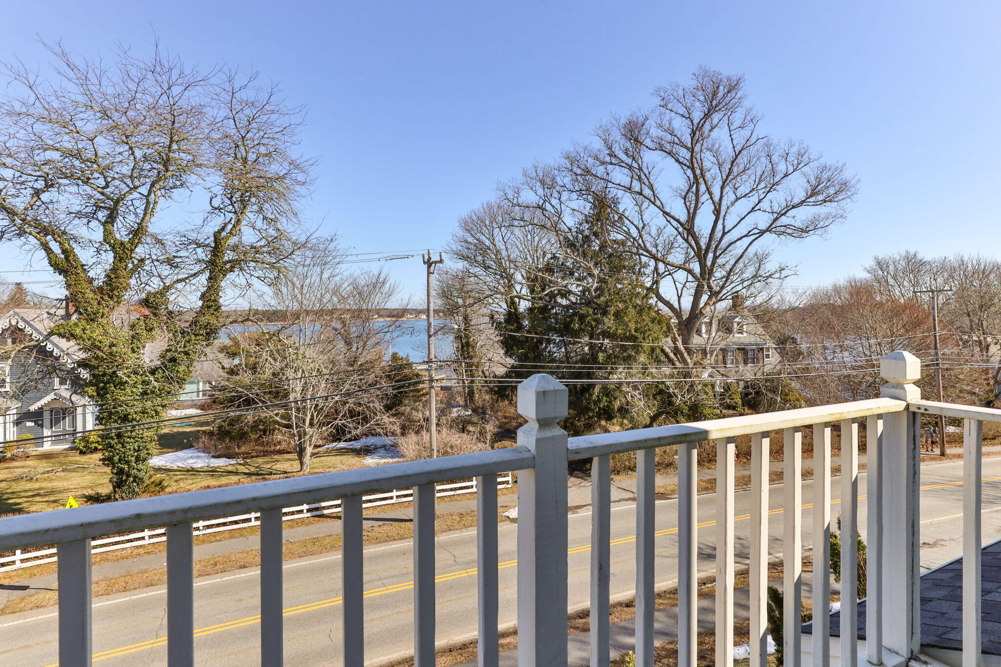 925 Main Street, Unit 3 Cotuit, MA 02635 - Photo 33 of 55 a view of a street from a balcony