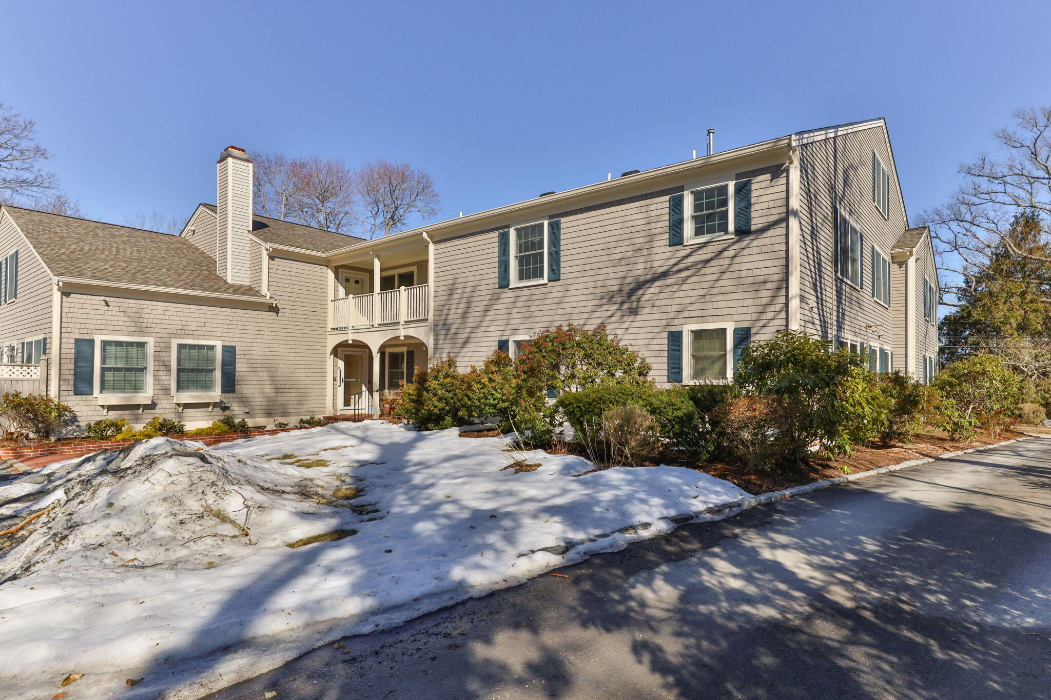 925 Main Street, Unit 3 Cotuit, MA 02635 - Photo 37 of 55 a front view of a house with a yard