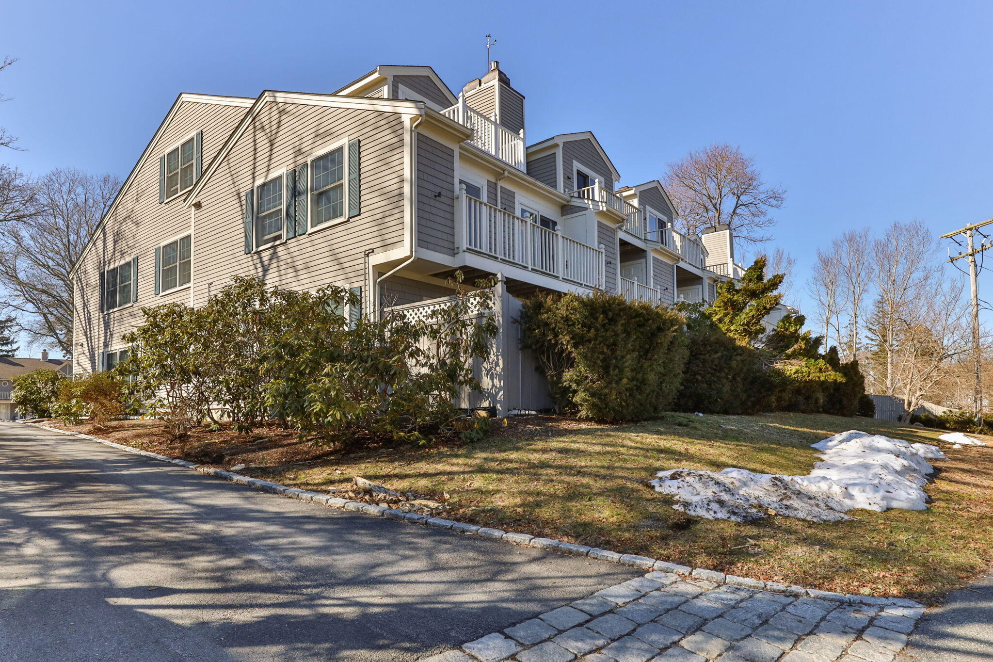 925 Main Street, Unit 3 Cotuit, MA 02635 - Photo 4 of 55 a view of a white house with a yard