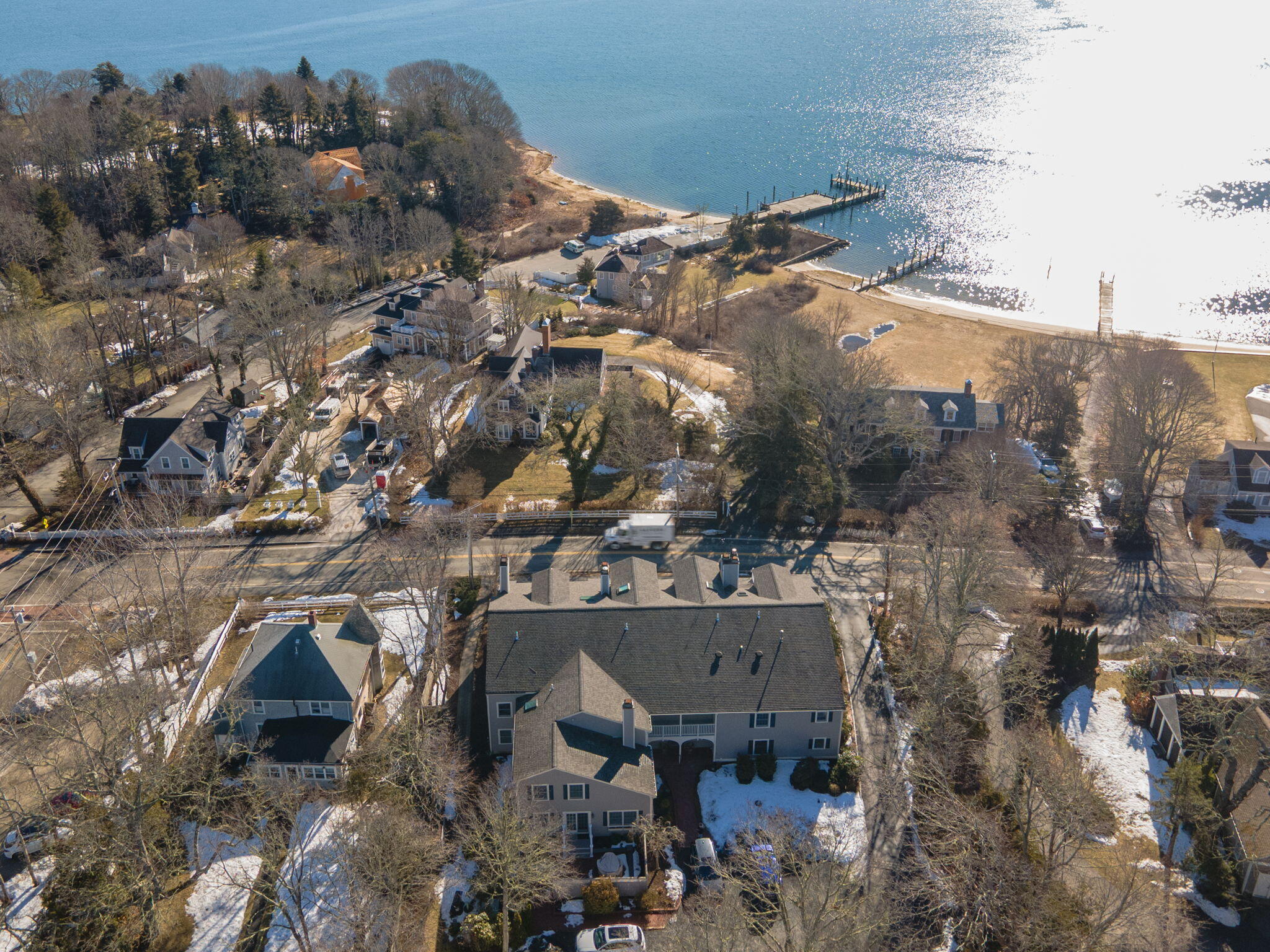925 Main Street, Unit 3 Cotuit, MA 02635 - Photo 42 of 55 an aerial view of a house with a yard
