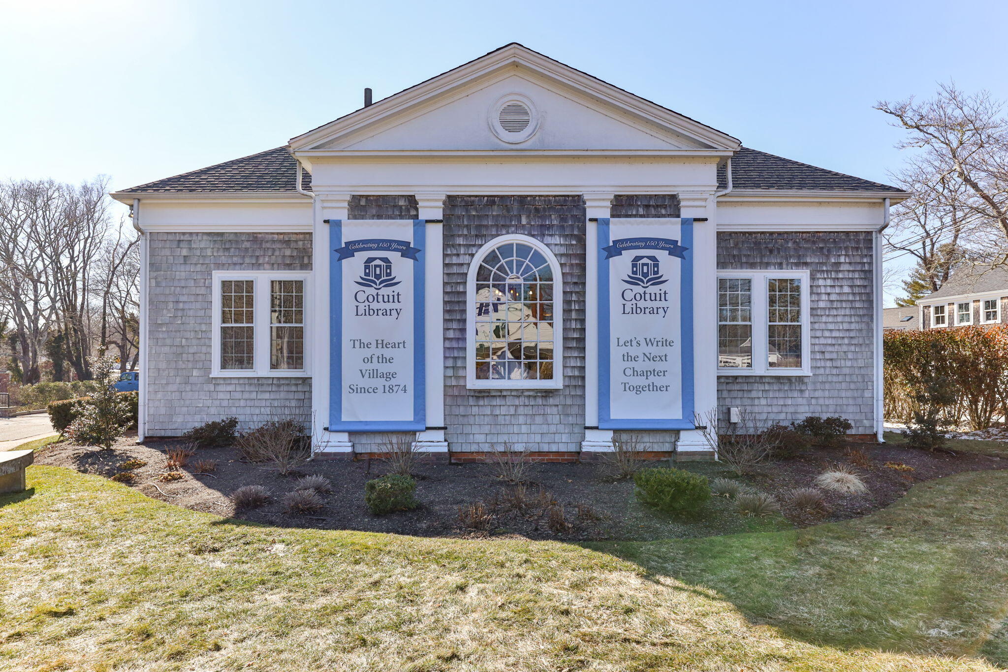 925 Main Street, Unit 3 Cotuit, MA 02635 - Photo 48 of 55 a front view of a house with garden