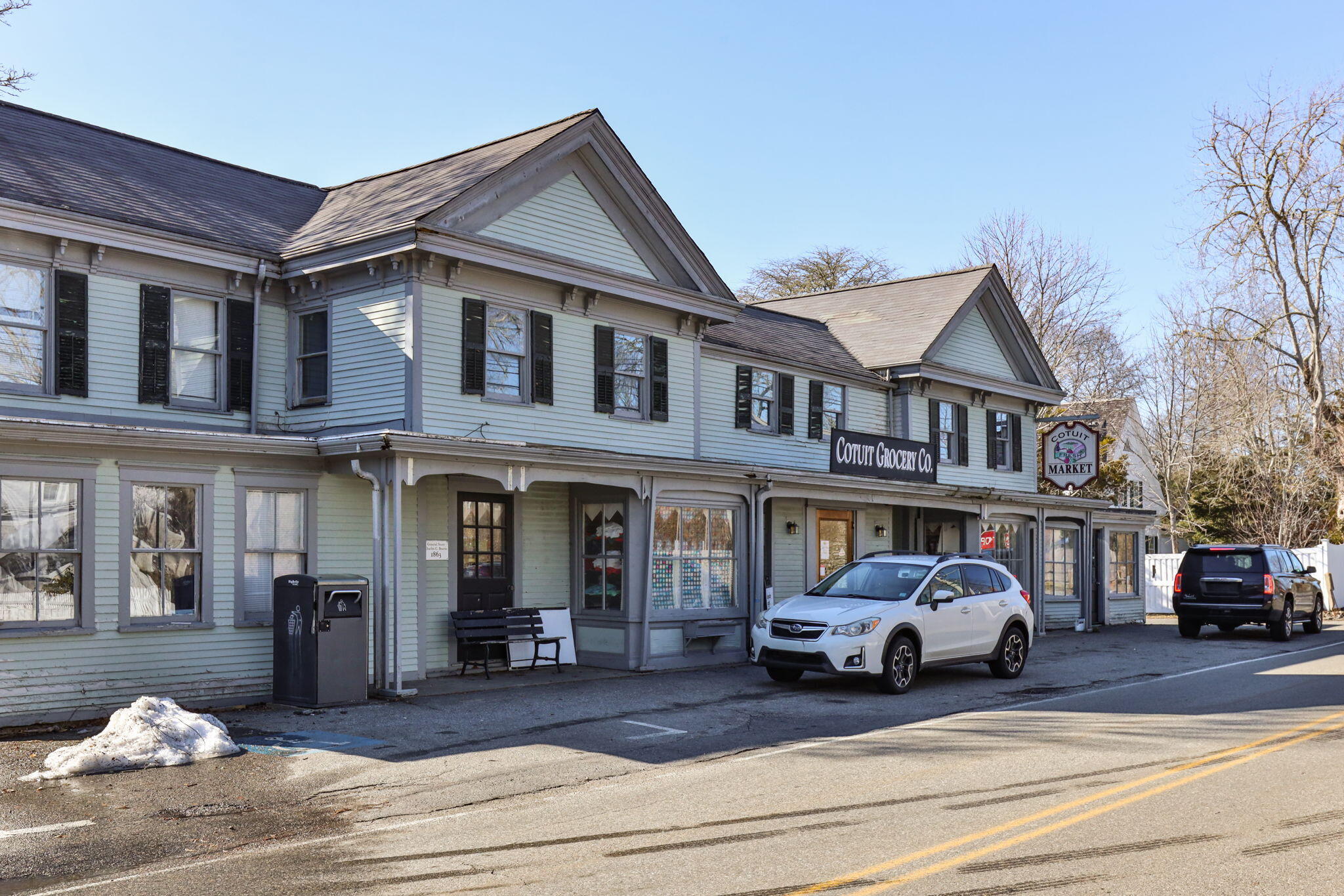 925 Main Street, Unit 3 Cotuit, MA 02635 - Photo 49 of 55 a view of a car park in front of a building