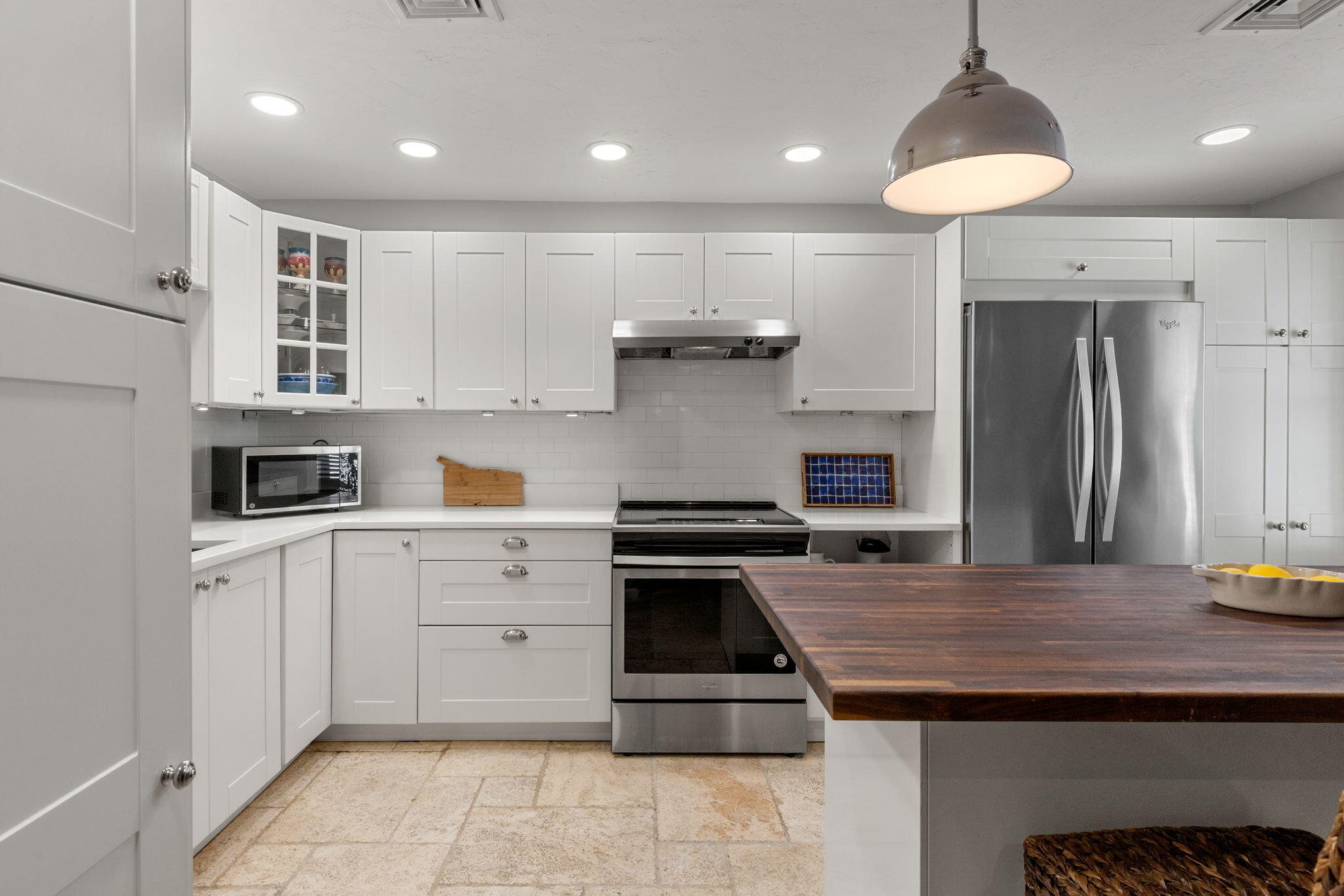 925 Main Street, Unit 3 Cotuit, MA 02635 - Photo 9 of 55 a kitchen with a stove a sink and a refrigerator