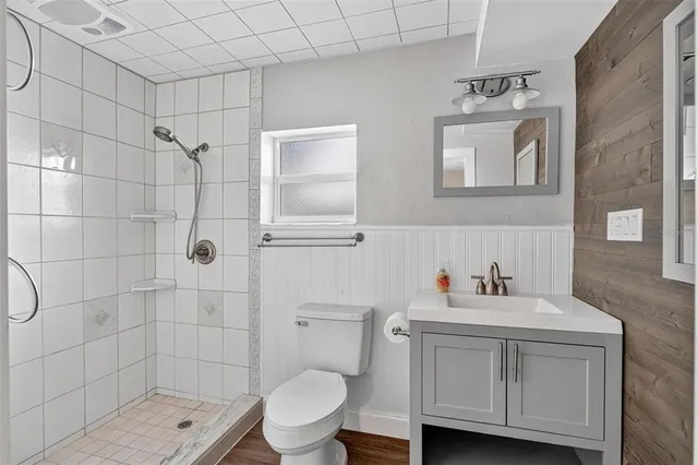 front view of a house with a yard and potted plants