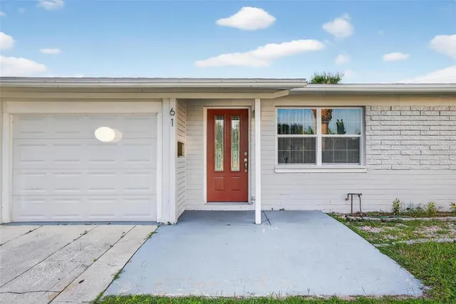 an aerial view of house with yard
