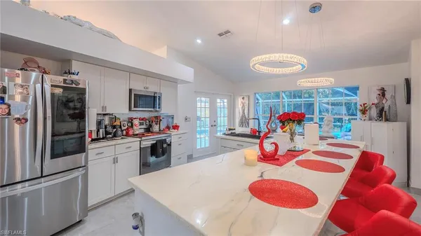 a view of a kitchen and a dining table