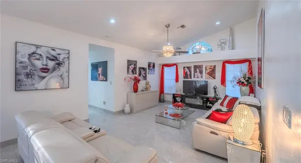a living room with furniture and a flat screen tv