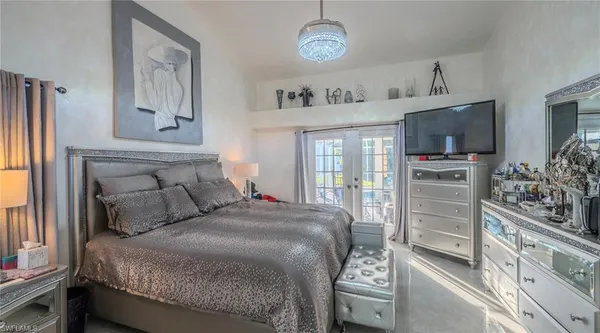 a spacious bathroom with a toilet a sink and a mirror