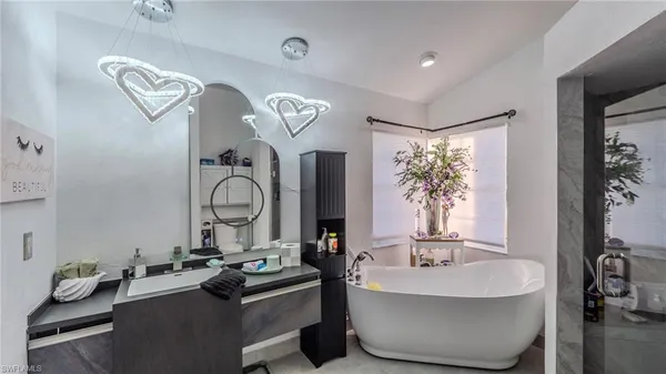 a bedroom with a bed and a table