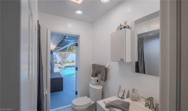 a bathroom with a toilet sink shower and bathtub