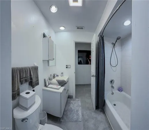 a view of a house with a big yard potted plants and large tree