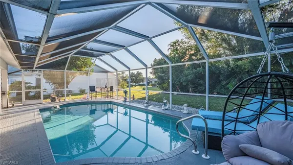 a view of a swimming pool with a patio