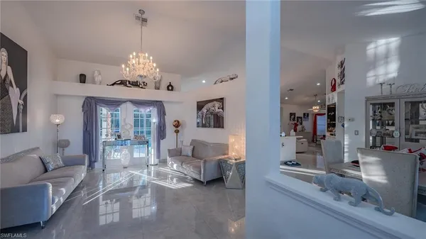 a view of a livingroom with furniture and chandelier