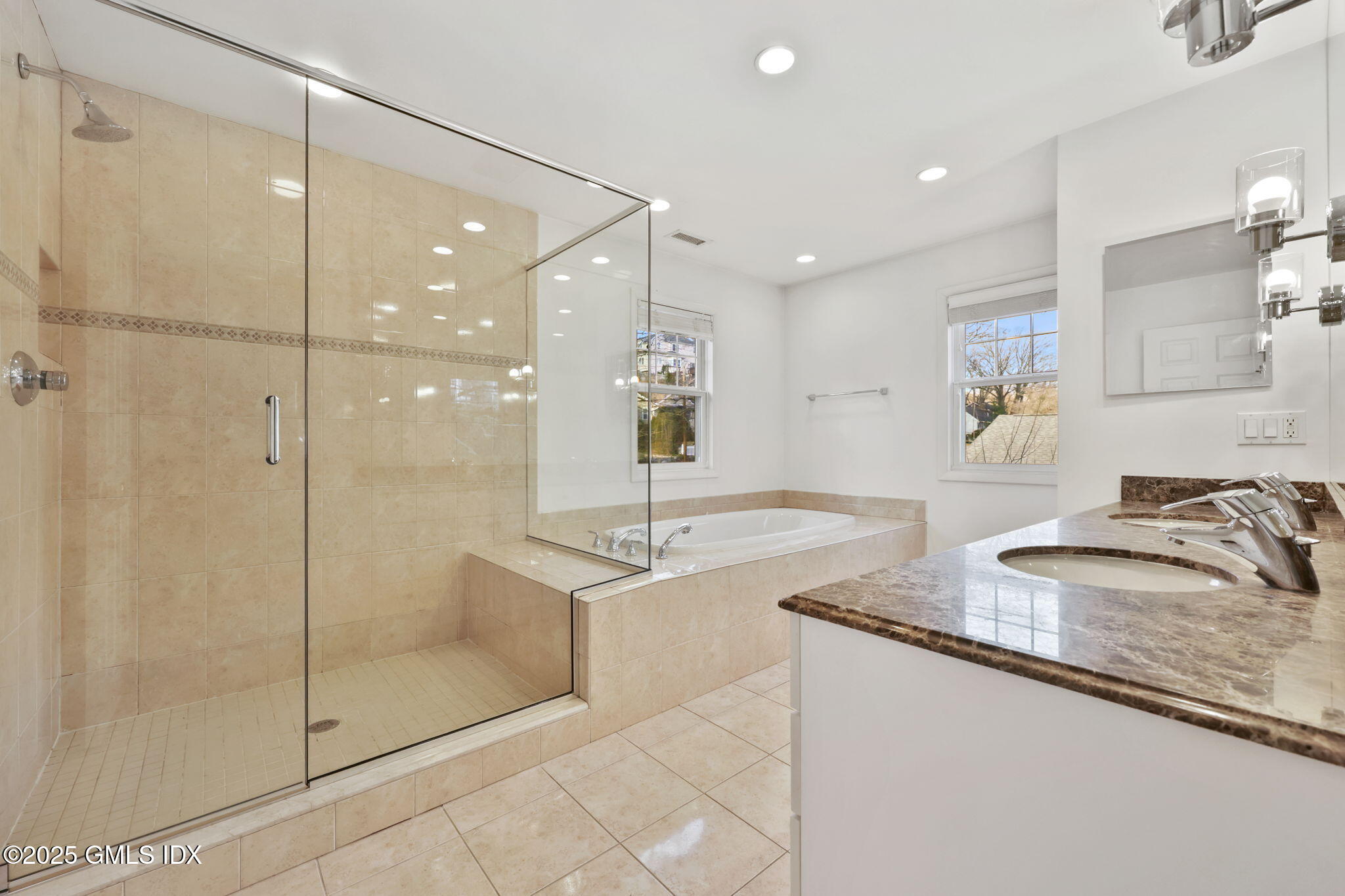 53 Midbrook Lane Old Greenwich, CT 06870 - Photo 19 of 39 a bathroom with a granite countertop sink a mirror and shower