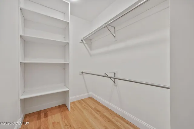 a view of an empty walk in closet